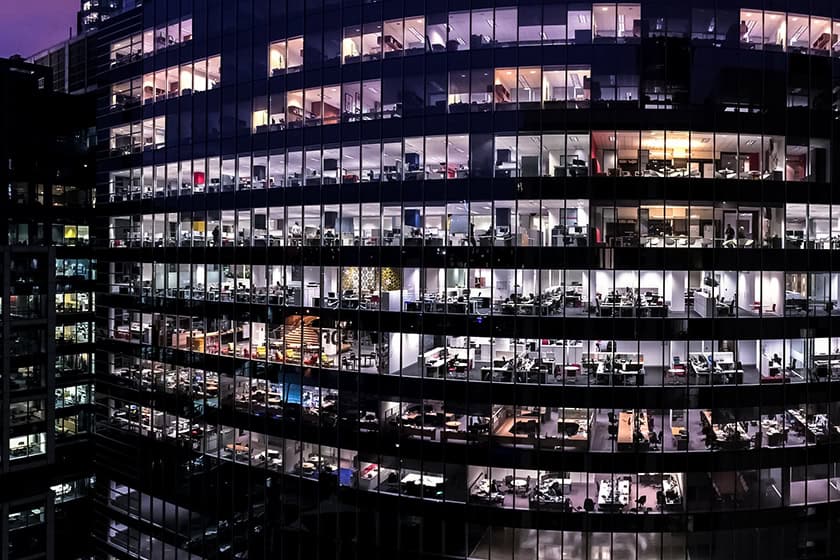 federal-election-GettyImages-72867997 Exterior of a large commercial building at night. Many offices are still lit up.