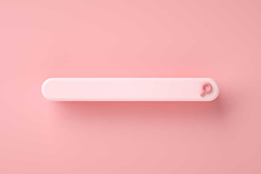 Man having lunch while working. The man is working from home - is eating a sandwhich - and is looking at spreadsheets.