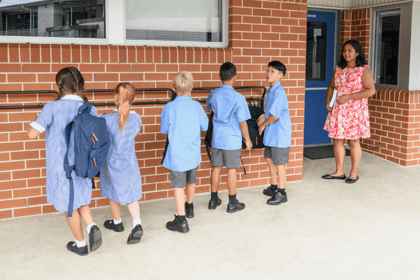 Photo of Australian primary school students lining up outside of the classroom waiting to go in.