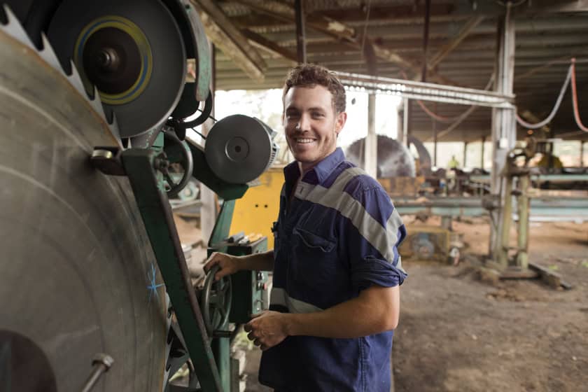 Tradesman operating machinery