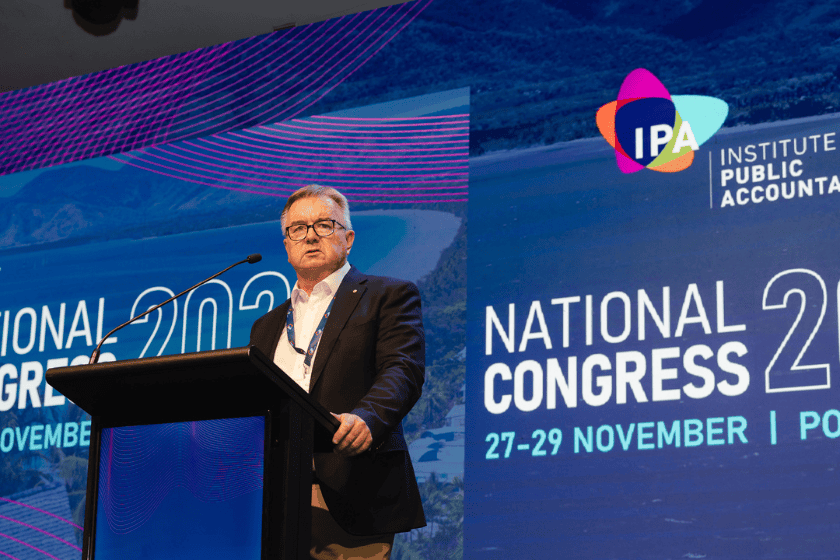 Peter de Cure, Chair of the Tax Practitioners Board, speaking at a podium